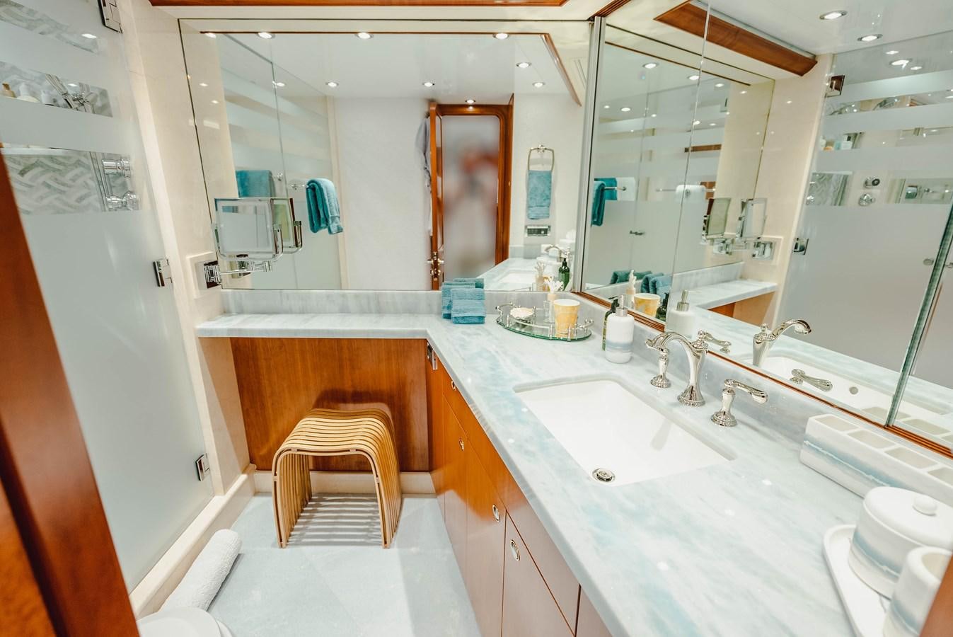 a bathroom with a sink and a mirror aboard LA LADY Yacht for Sale
