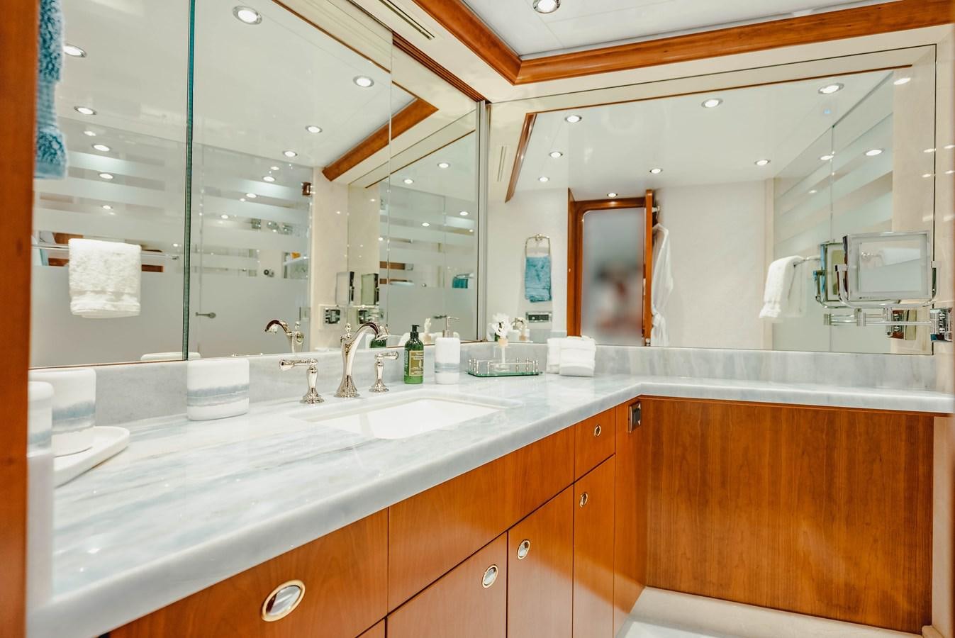 a bathroom with a large mirror aboard LA LADY Yacht for Sale