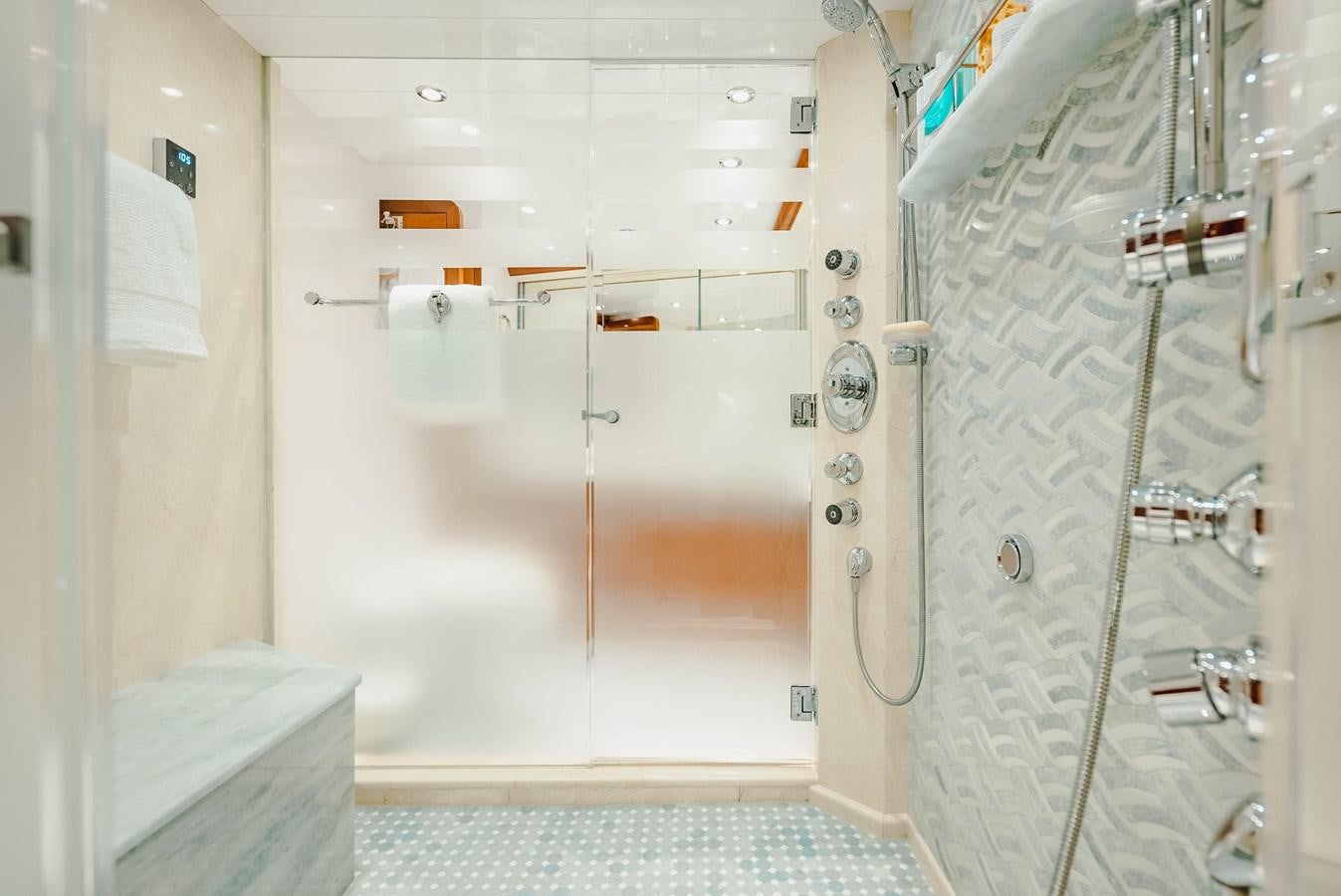 a bathroom with a shower aboard LA LADY Yacht for Sale