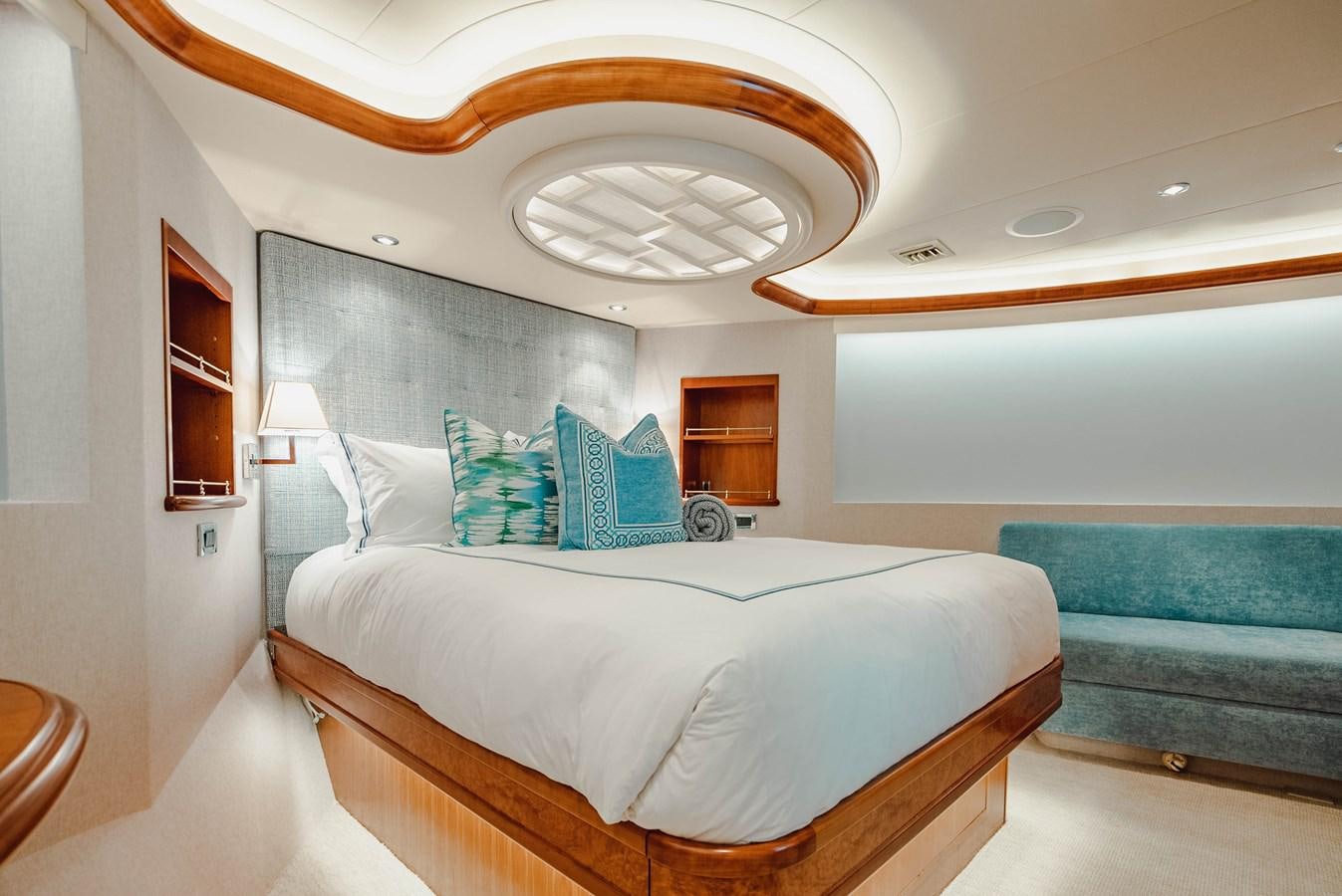 a large bedroom with a bed aboard LA LADY Yacht for Sale