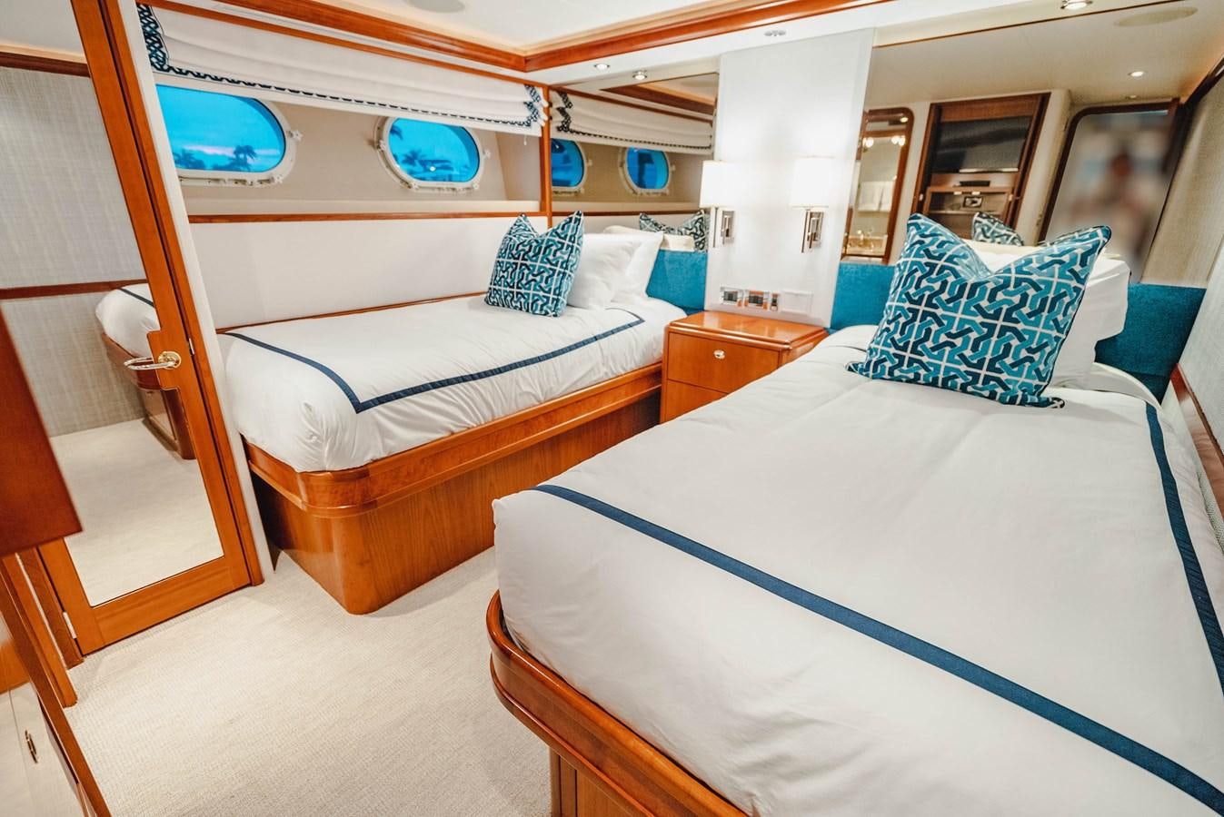 a couple of beds in a room aboard LA LADY Yacht for Sale