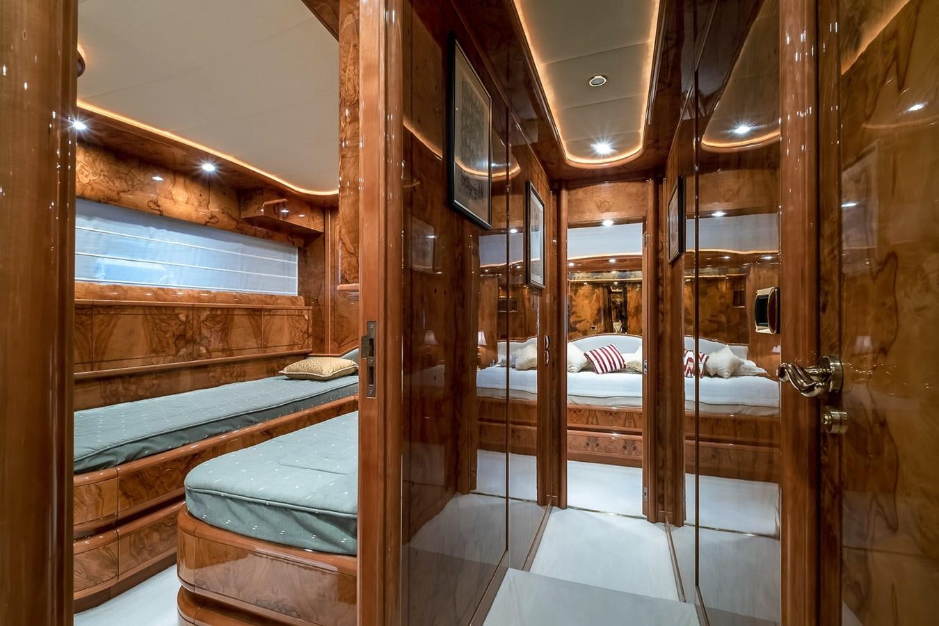 a room with a bed and a wood door aboard LADY ADELHEID Yacht for Sale