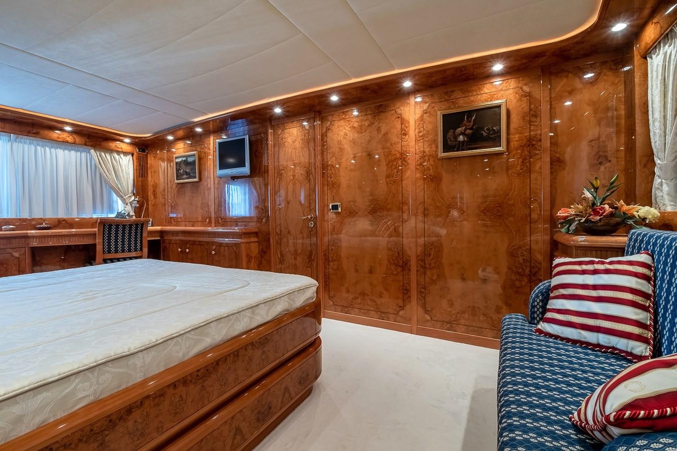 a room with a bed and a television aboard LADY ADELHEID Yacht for Sale