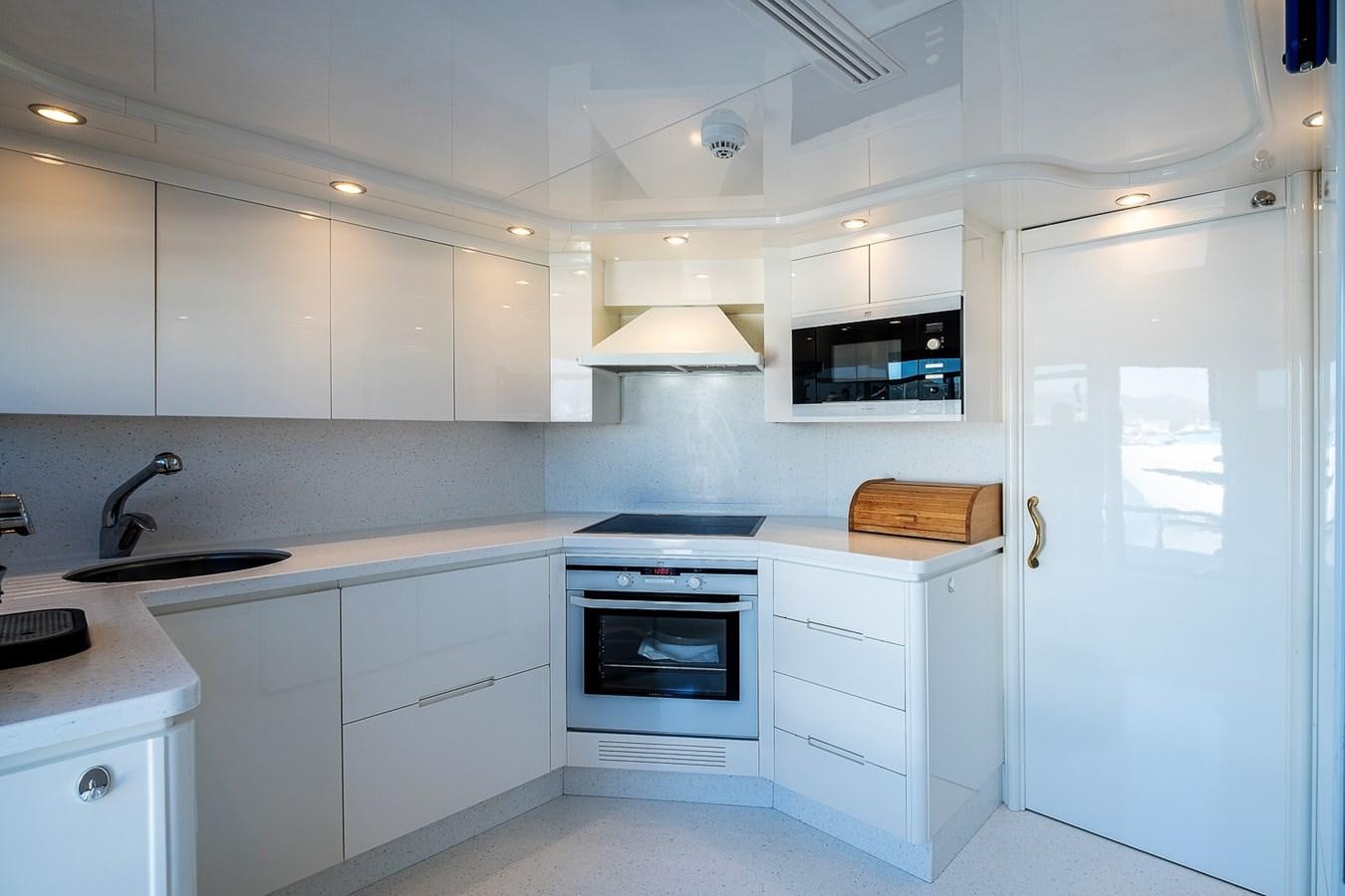 a kitchen with white cabinets aboard LADY ADELHEID Yacht for Sale