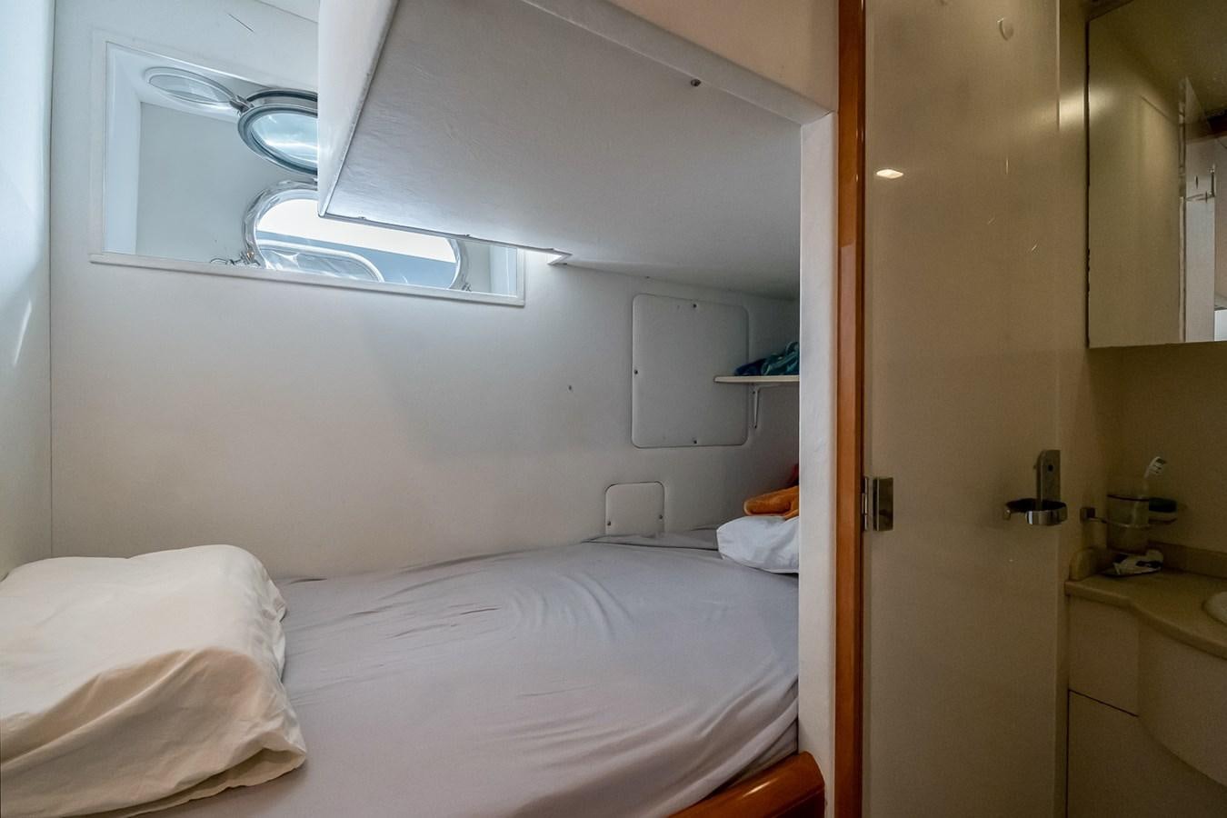 a room with a bed and a mirror aboard LADY ADELHEID Yacht for Sale