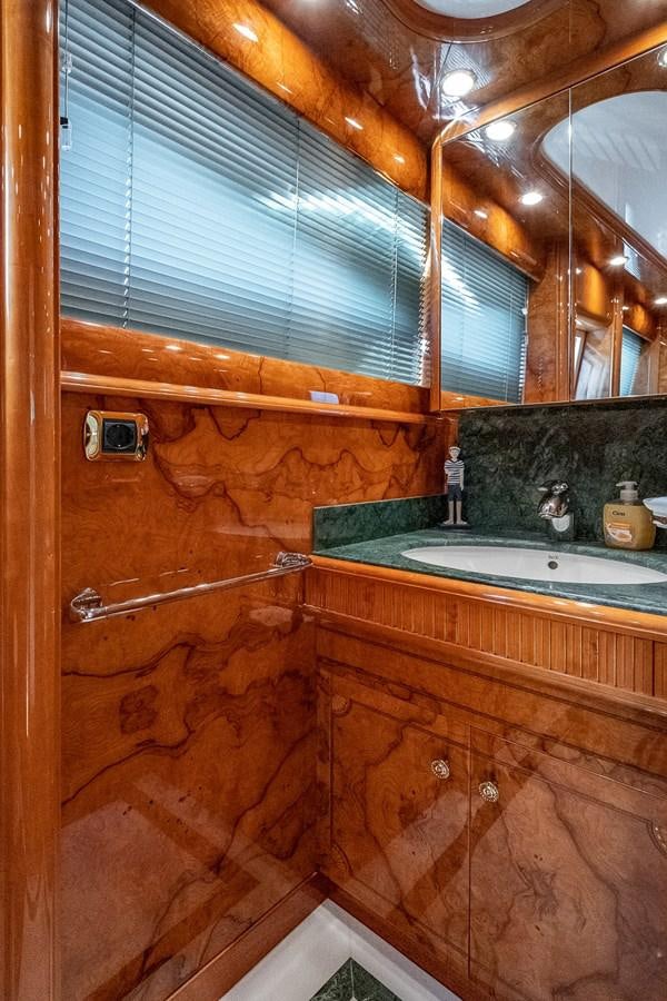 a bathroom with wooden walls aboard LADY ADELHEID Yacht for Sale