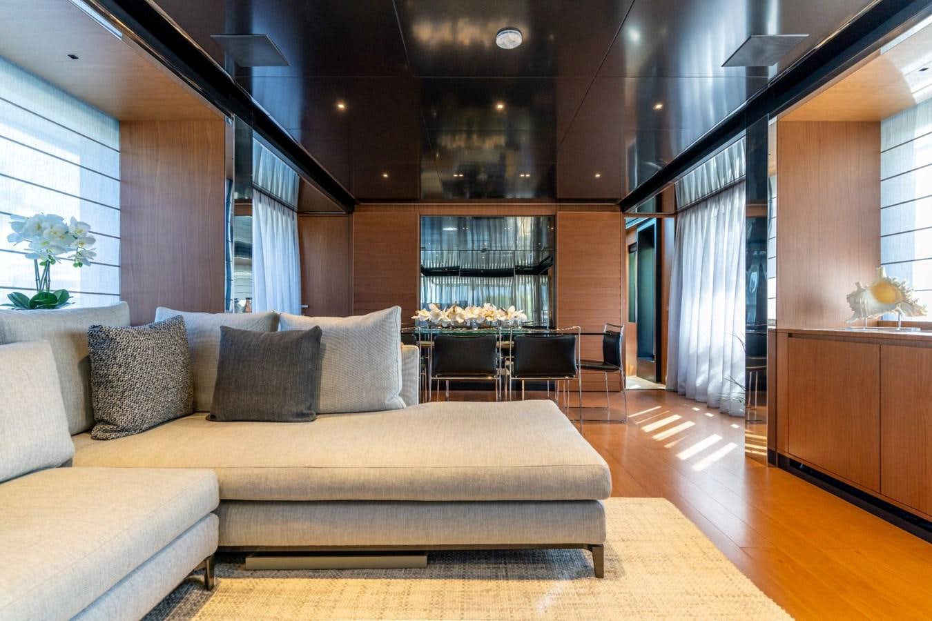 a living room with a couch and a table aboard BEYOND BEYOND Yacht for Sale