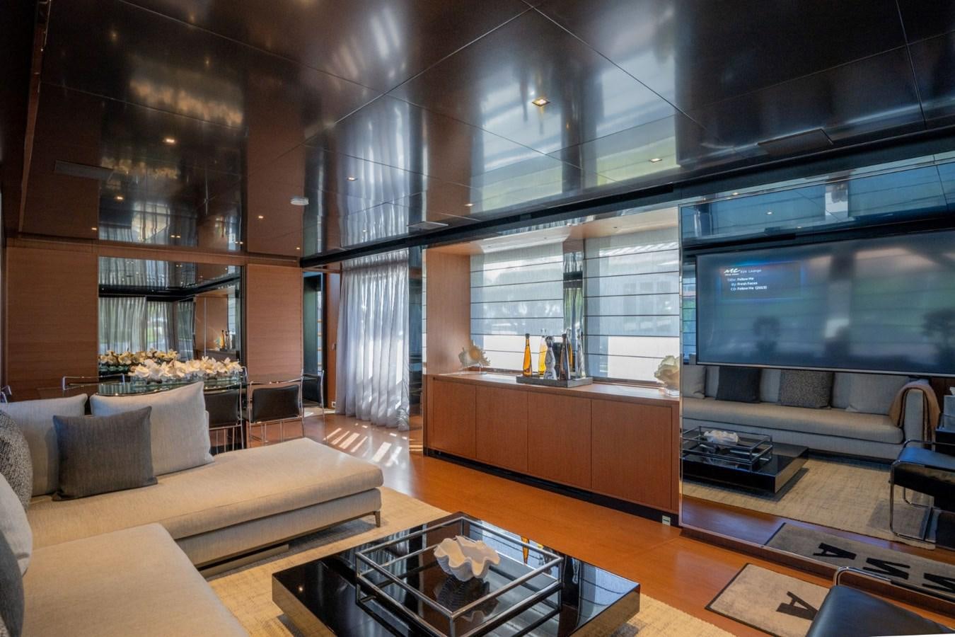 a room with a couch and a tv aboard BEYOND BEYOND Yacht for Sale