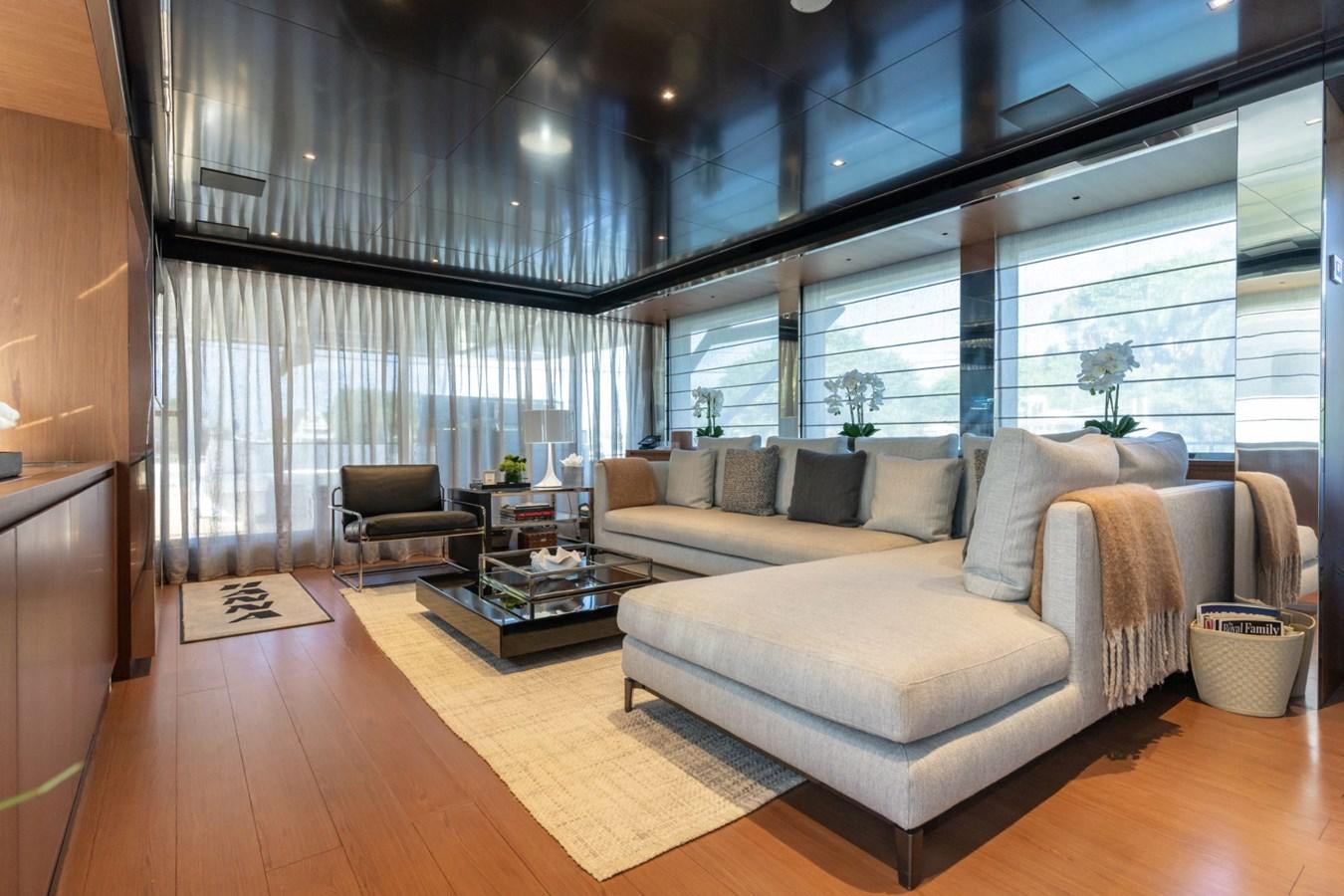 a living room with a large window aboard BEYOND BEYOND Yacht for Sale