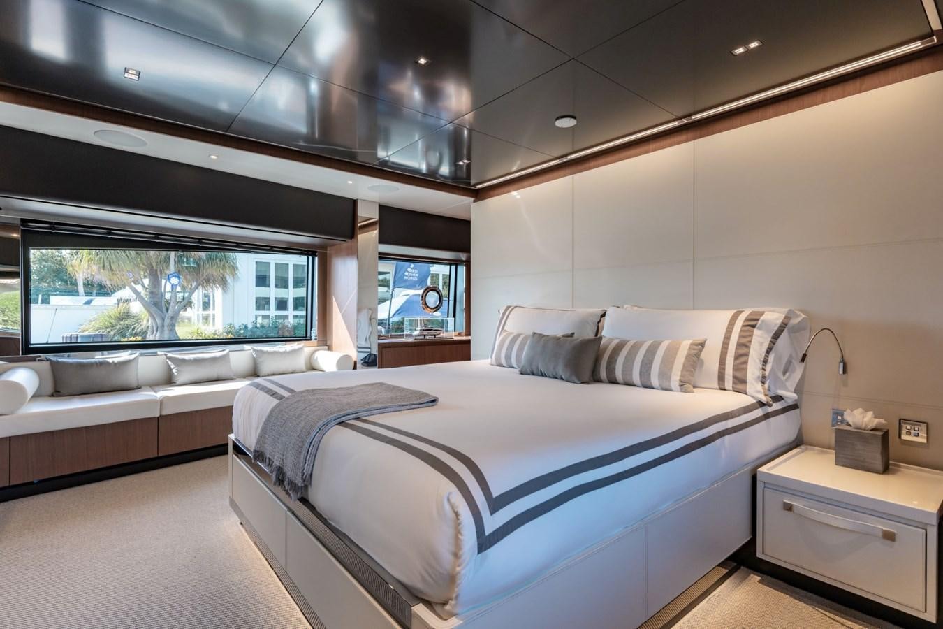 a room with a bed and a window aboard BEYOND BEYOND Yacht for Sale