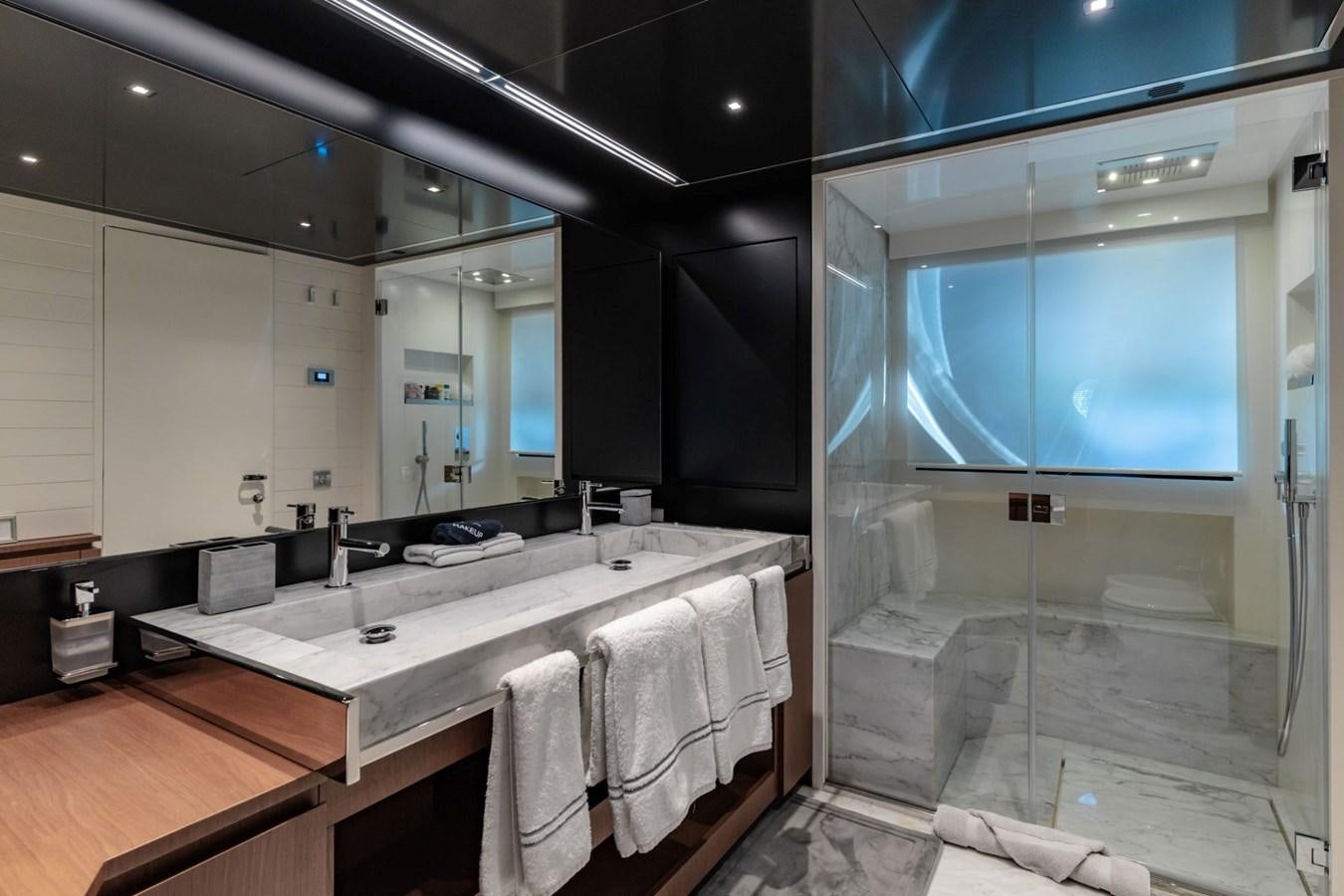 a bathroom with a large mirror aboard BEYOND BEYOND Yacht for Sale