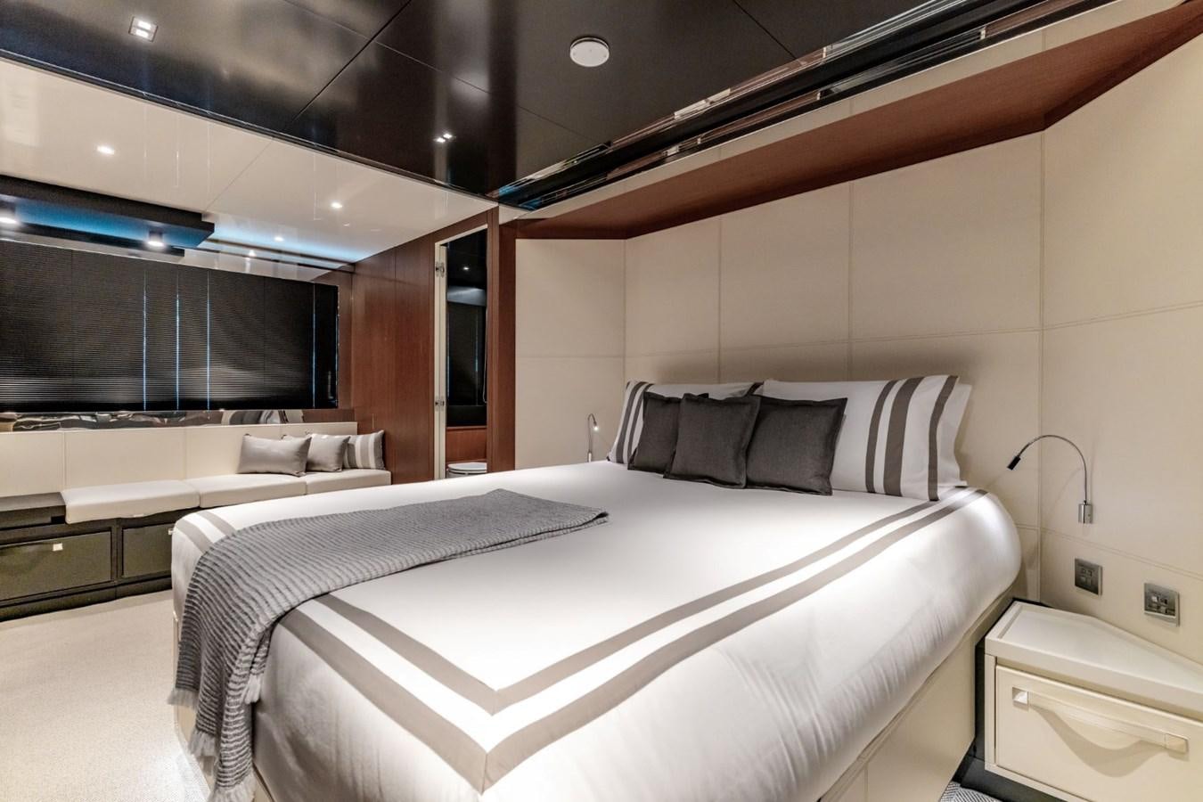 a room with a bed and a tv aboard BEYOND BEYOND Yacht for Sale