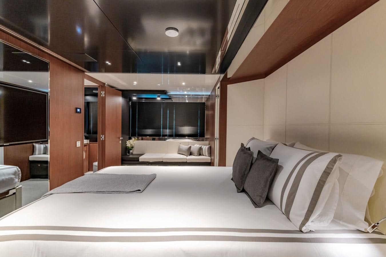 a bed with white sheets aboard BEYOND BEYOND Yacht for Sale