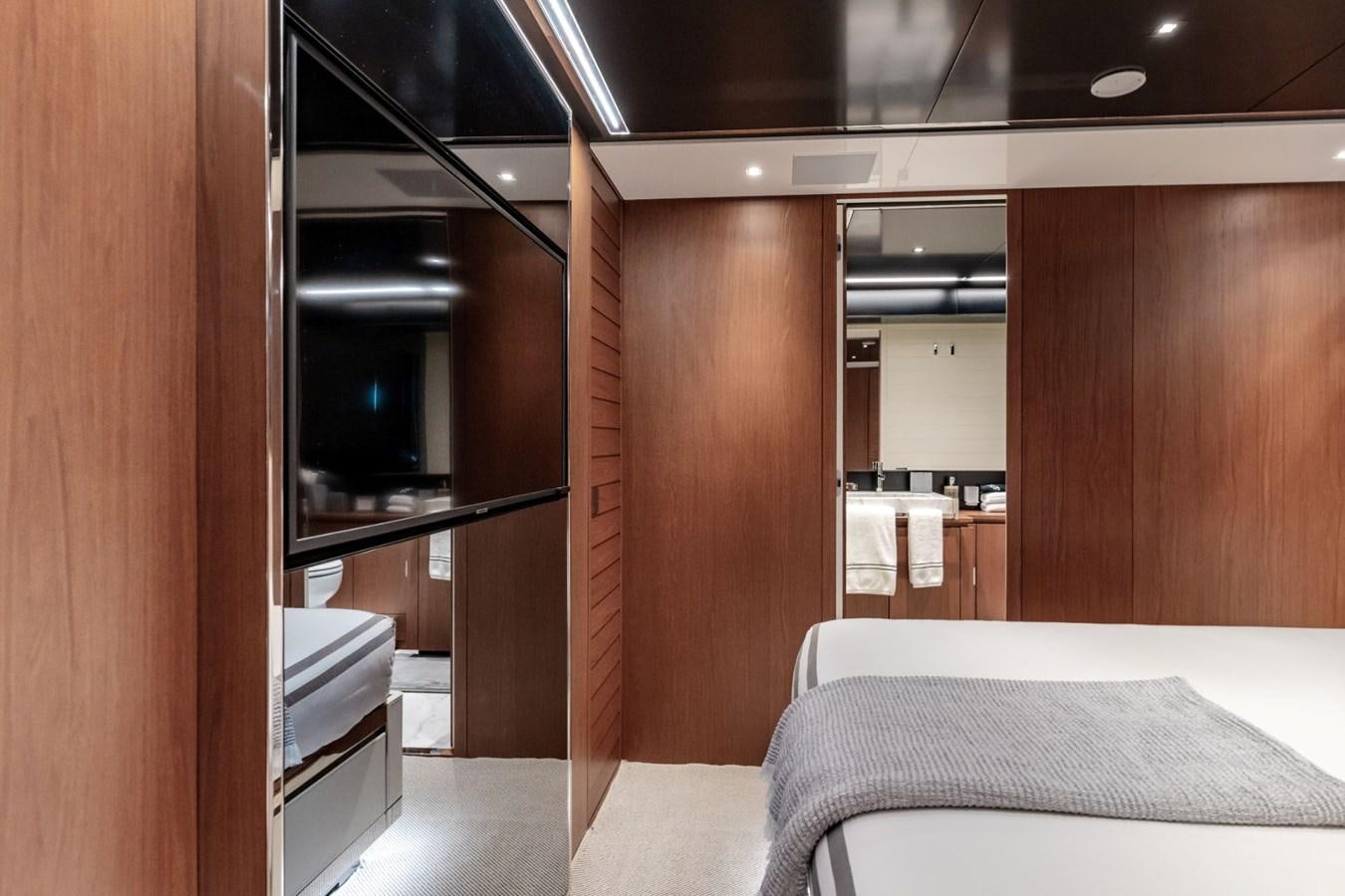 a room with a bed and a closet aboard BEYOND BEYOND Yacht for Sale