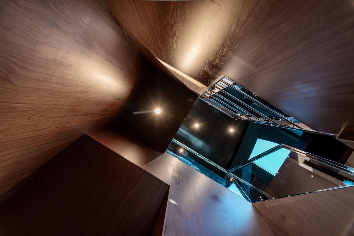 a guitar on a wood floor aboard BEYOND BEYOND Yacht for Sale