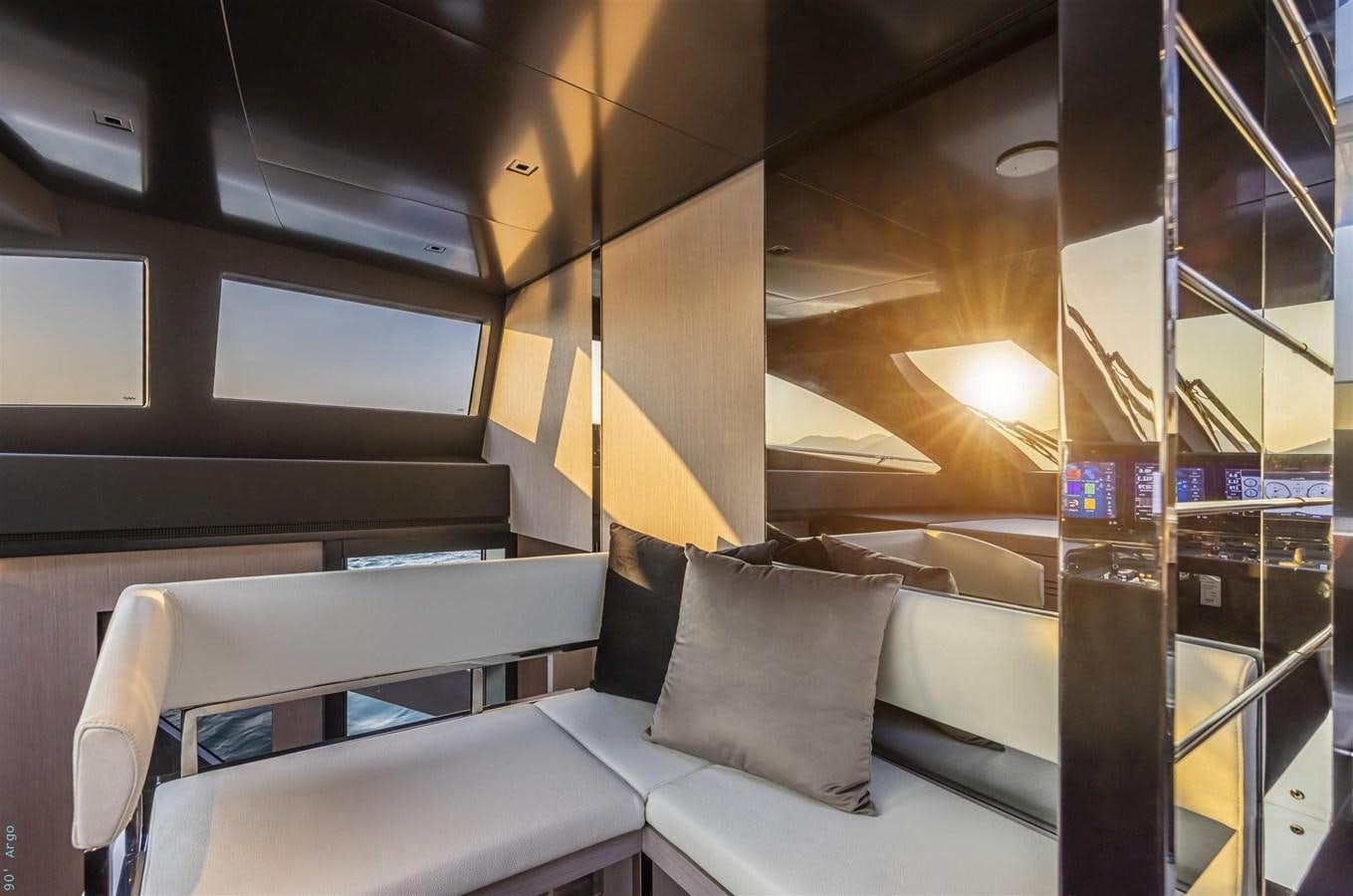 a room with a couch and a window aboard BEYOND BEYOND Yacht for Sale