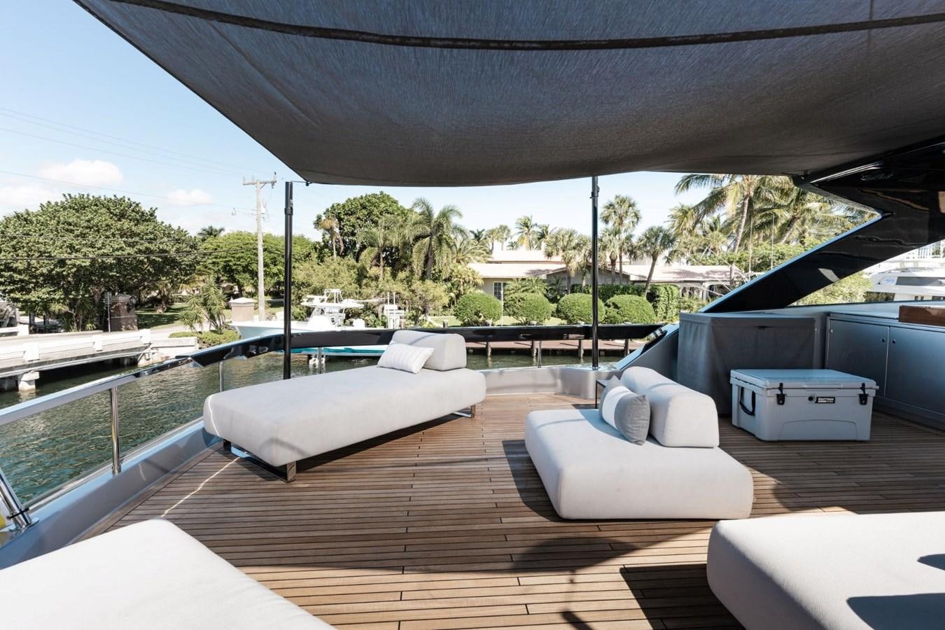 a deck with a pool and a deck with trees and a building aboard BEYOND BEYOND Yacht for Sale