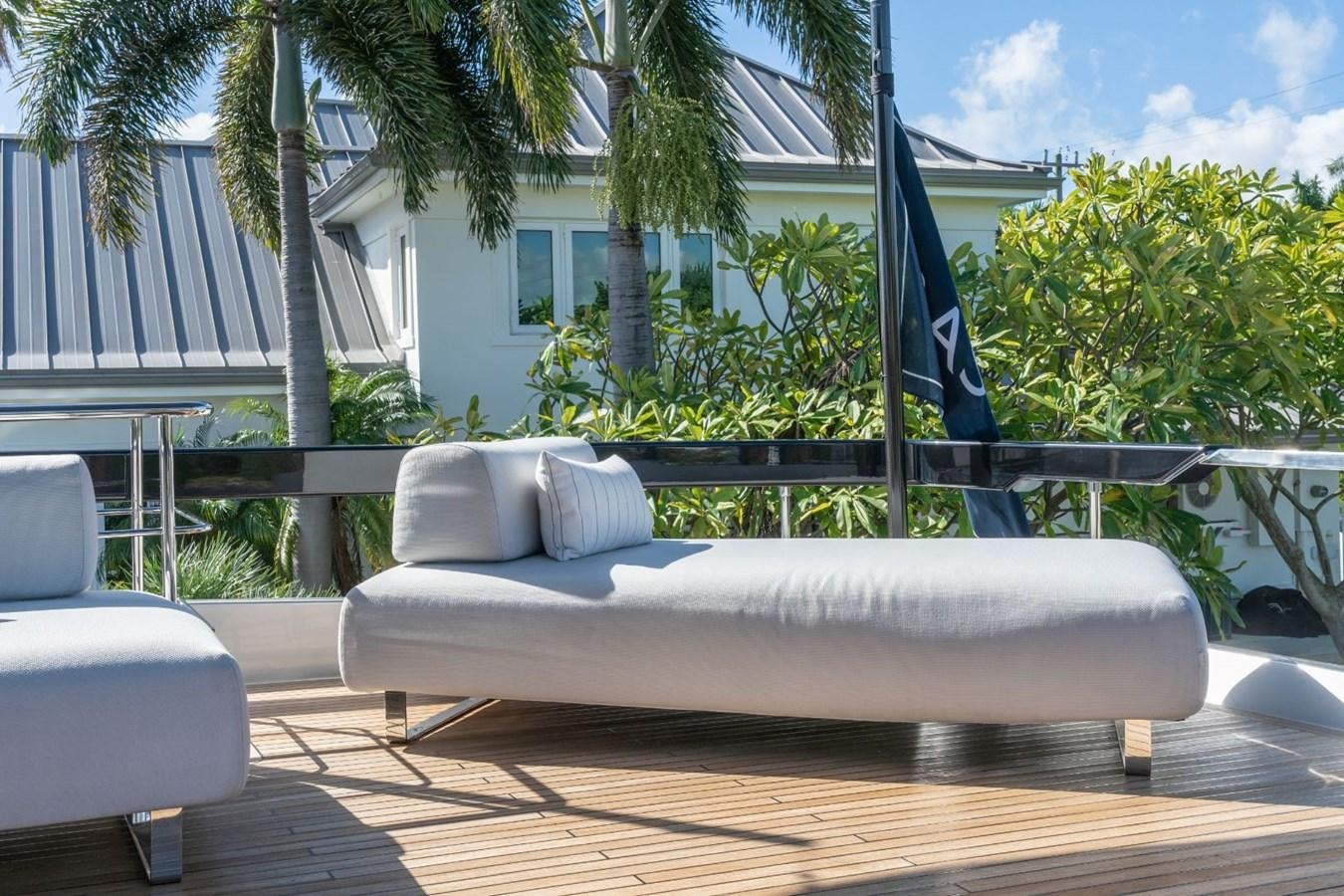 a white couch on a deck aboard BEYOND BEYOND Yacht for Sale