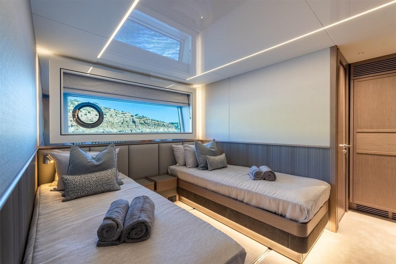 a room with a bed and a television aboard WORTH THE WAIT Yacht for Sale