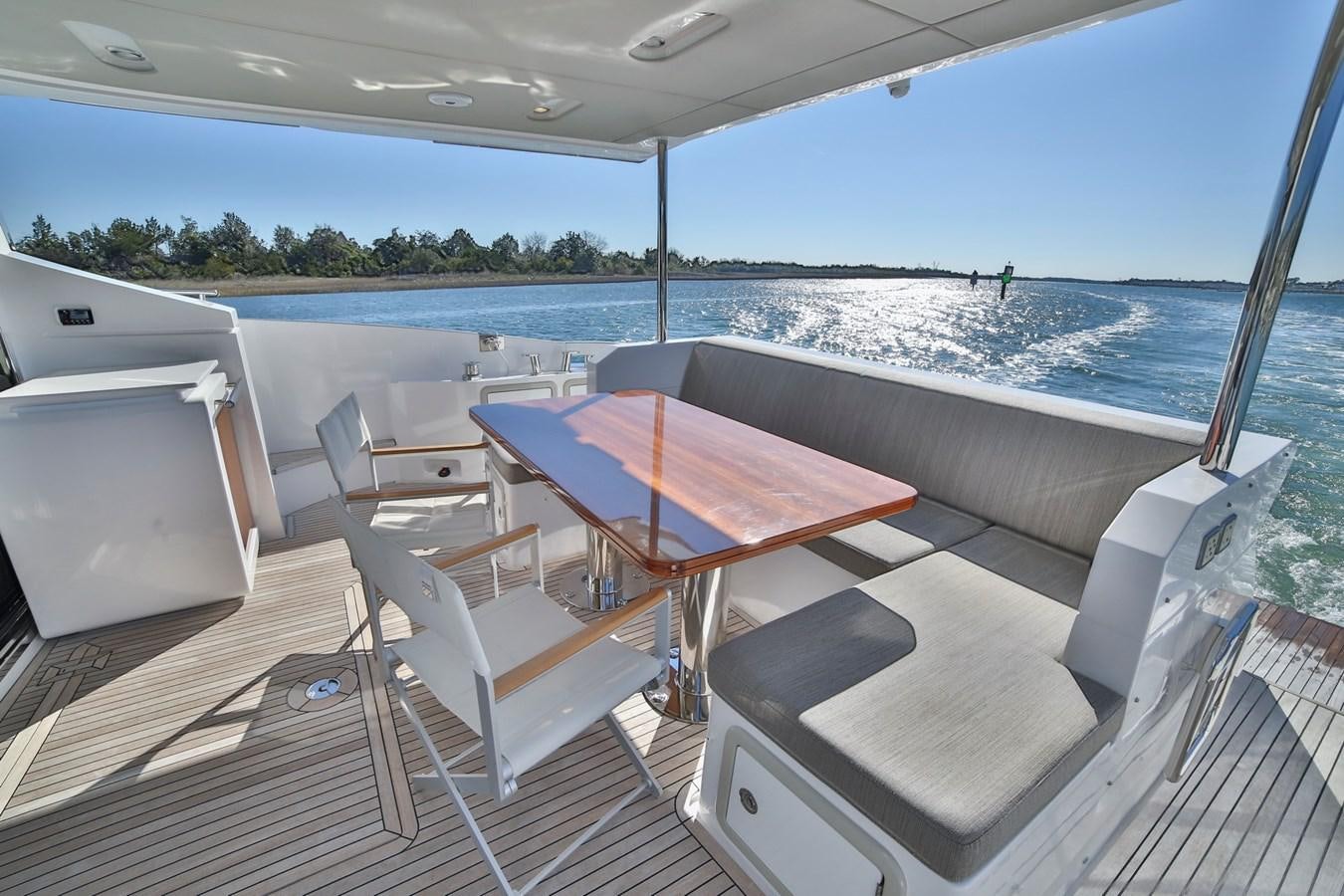 a table and chairs on a boat aboard SIRONA JOANNAH Yacht for Sale