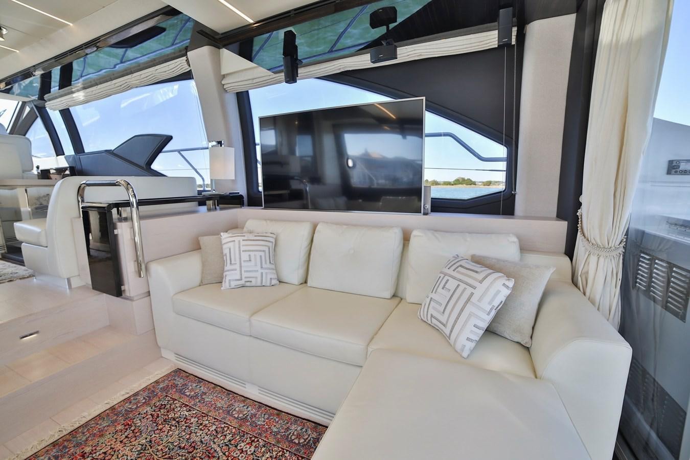 a living room with a large window aboard SIRONA JOANNAH Yacht for Sale