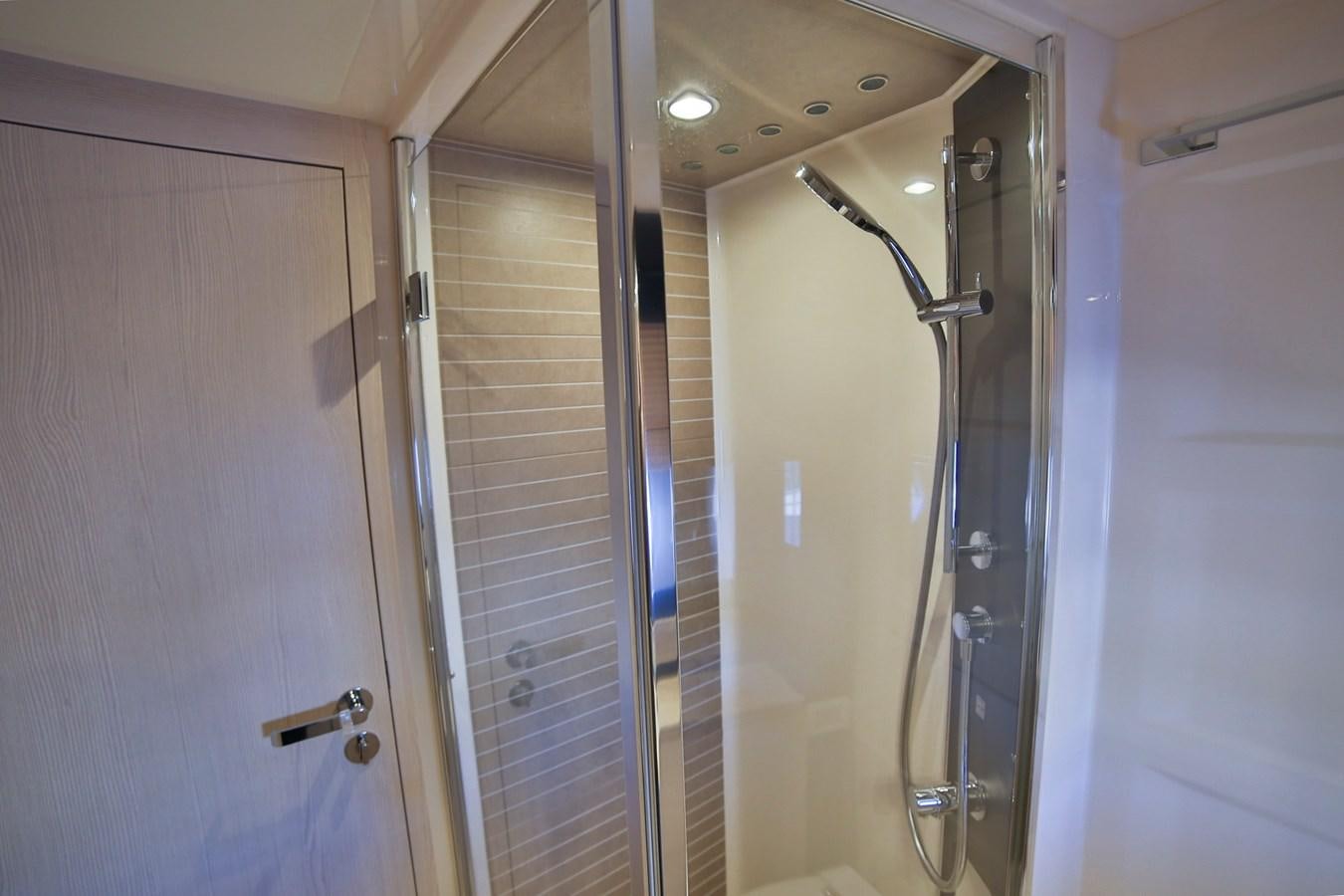 a bathroom with a glass shower aboard SIRONA JOANNAH Yacht for Sale
