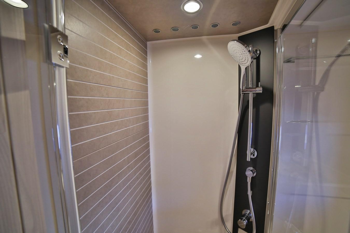 a room with a door and a shower aboard SIRONA JOANNAH Yacht for Sale