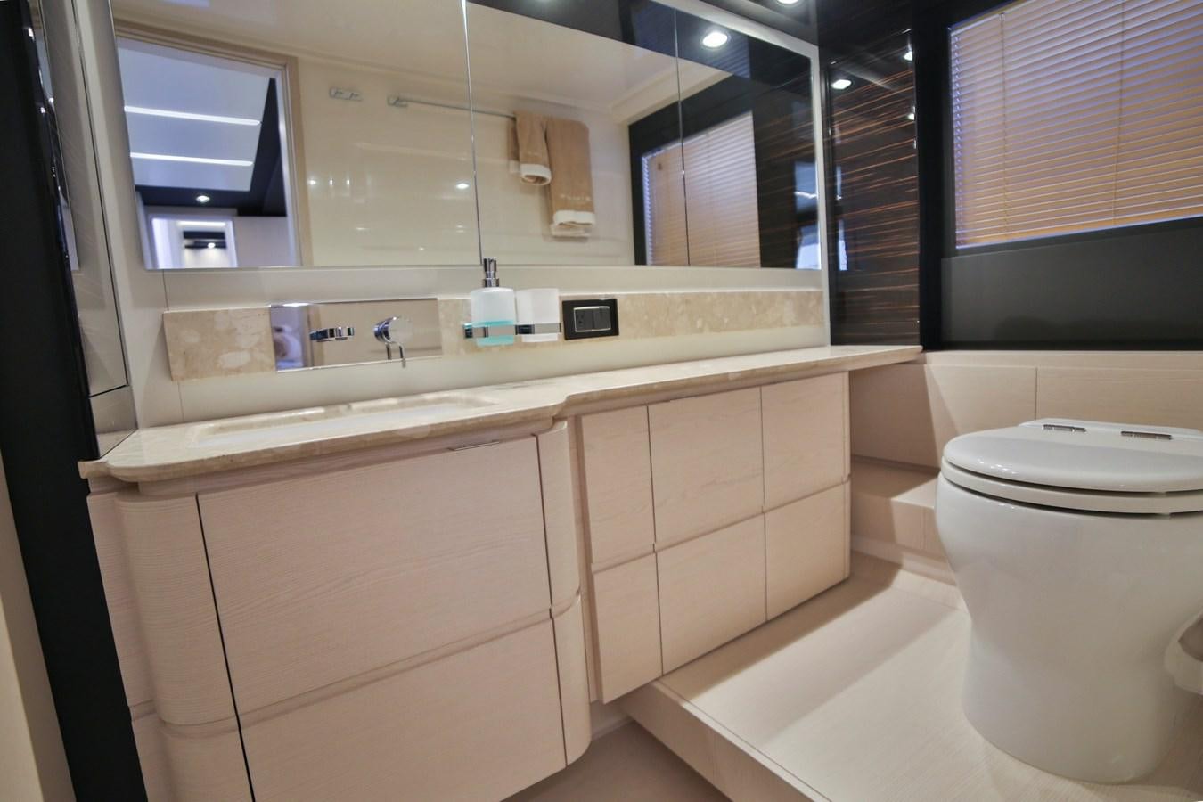 a bathroom with a toilet and a sink aboard SIRONA JOANNAH Yacht for Sale