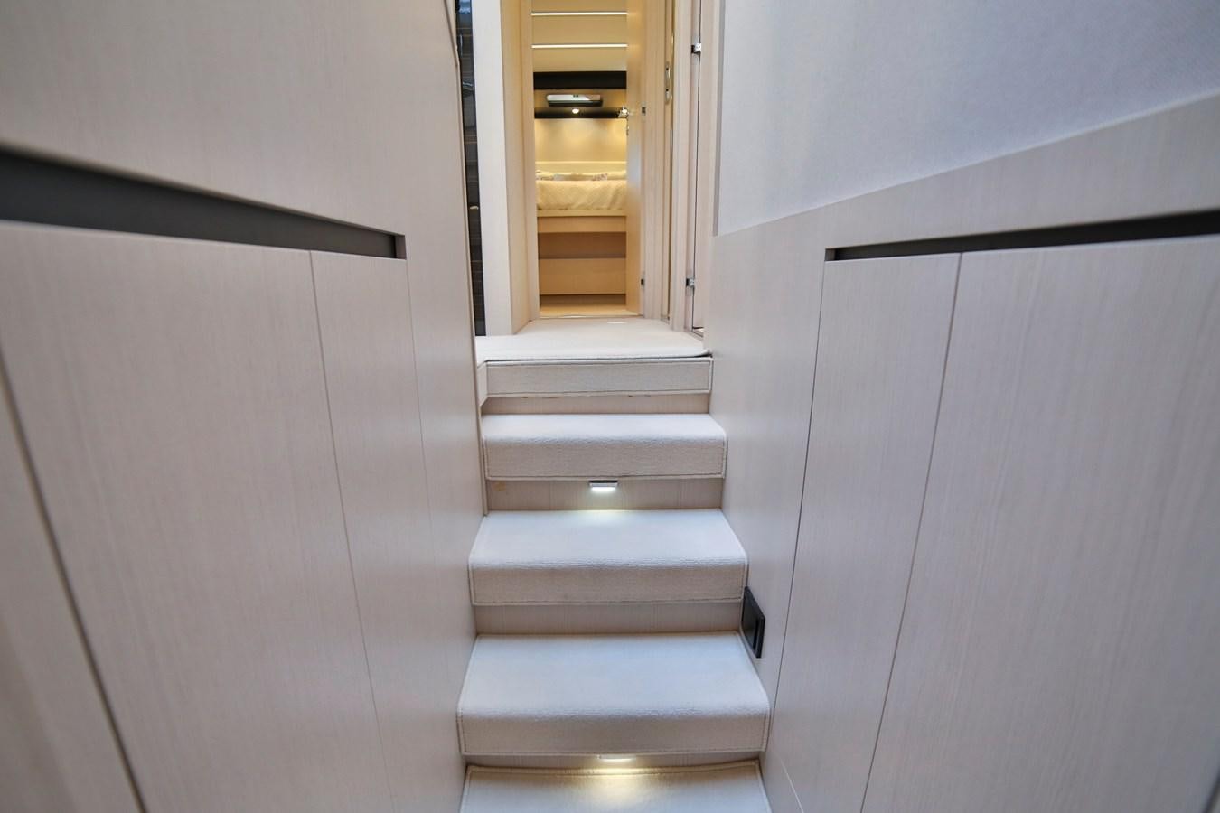 a white staircase in a room aboard SIRONA JOANNAH Yacht for Sale
