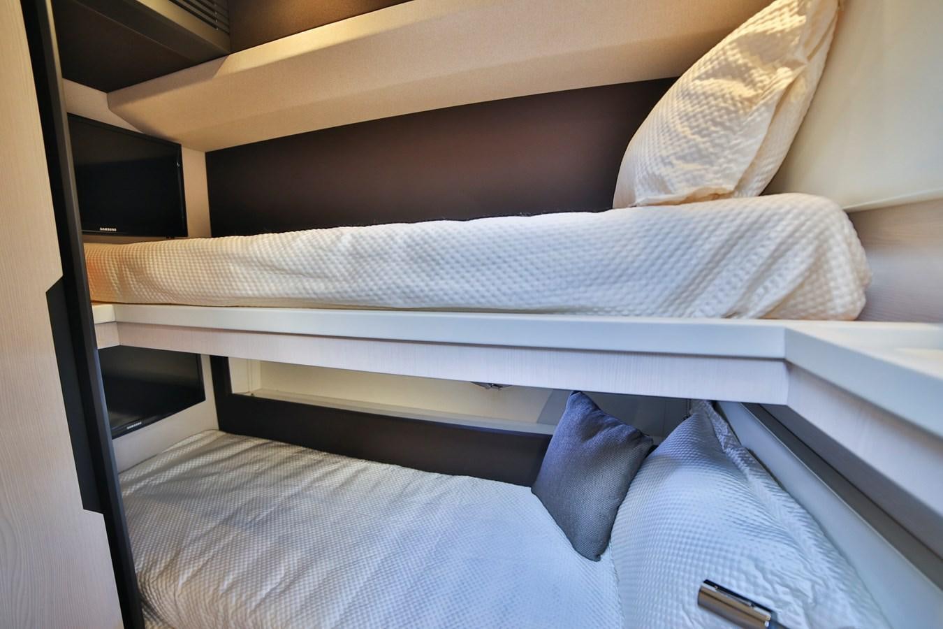 a bed with white sheets aboard SIRONA JOANNAH Yacht for Sale