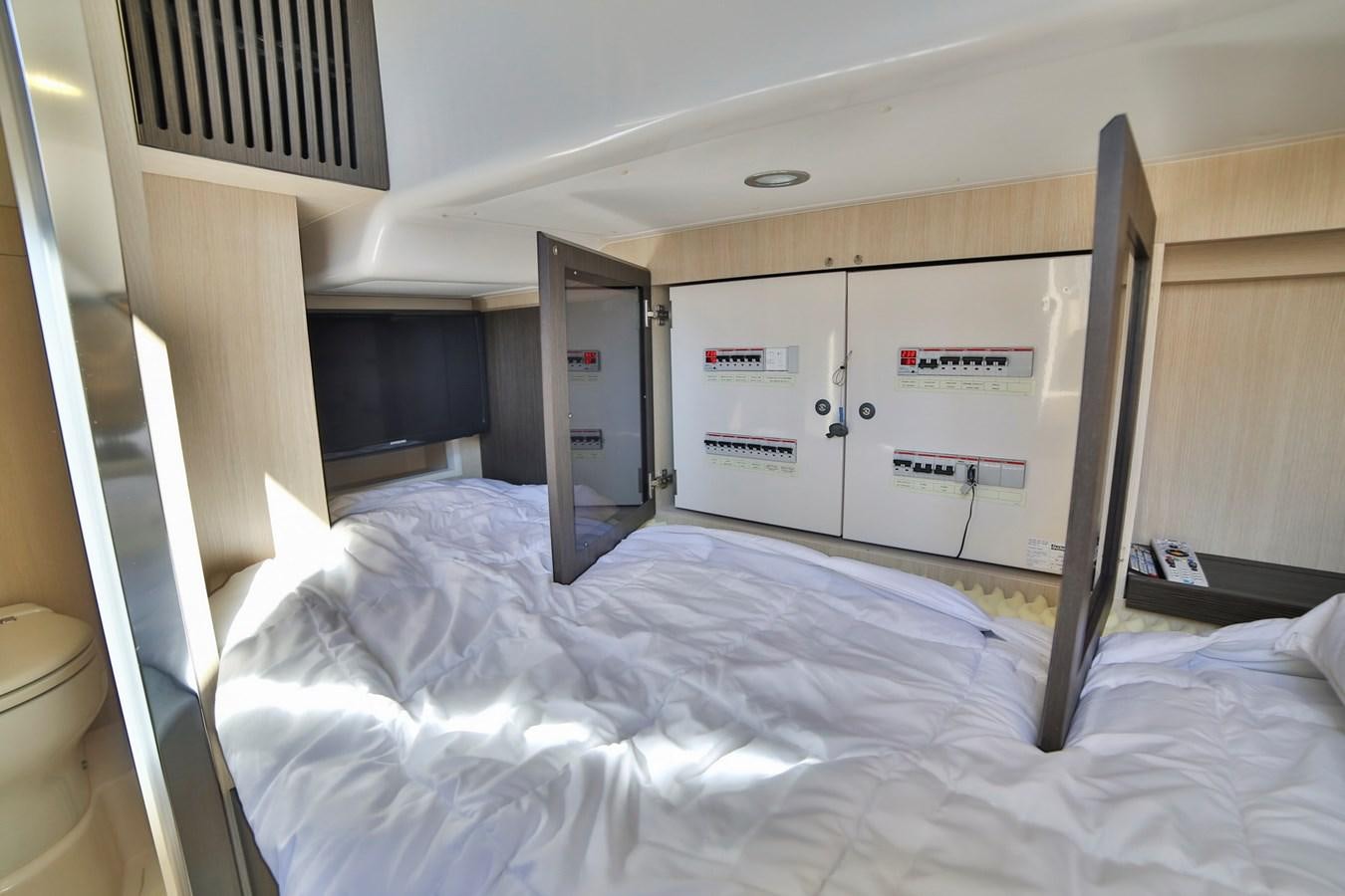 a bed in a room aboard SIRONA JOANNAH Yacht for Sale