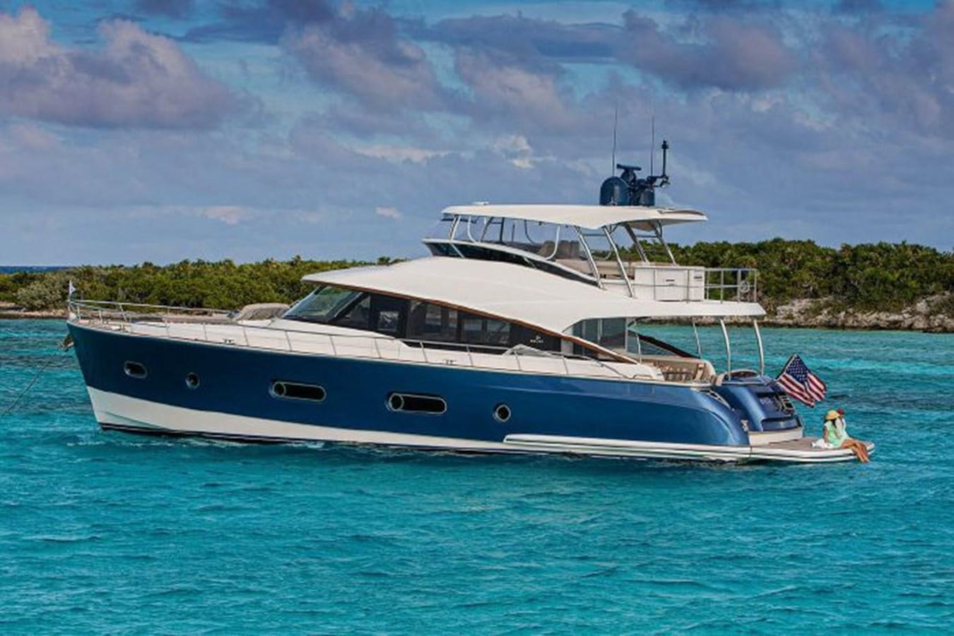 a boat in the water aboard 2023 RIVIERA 66 BELIZE DAYBRIDGE Yacht for Sale