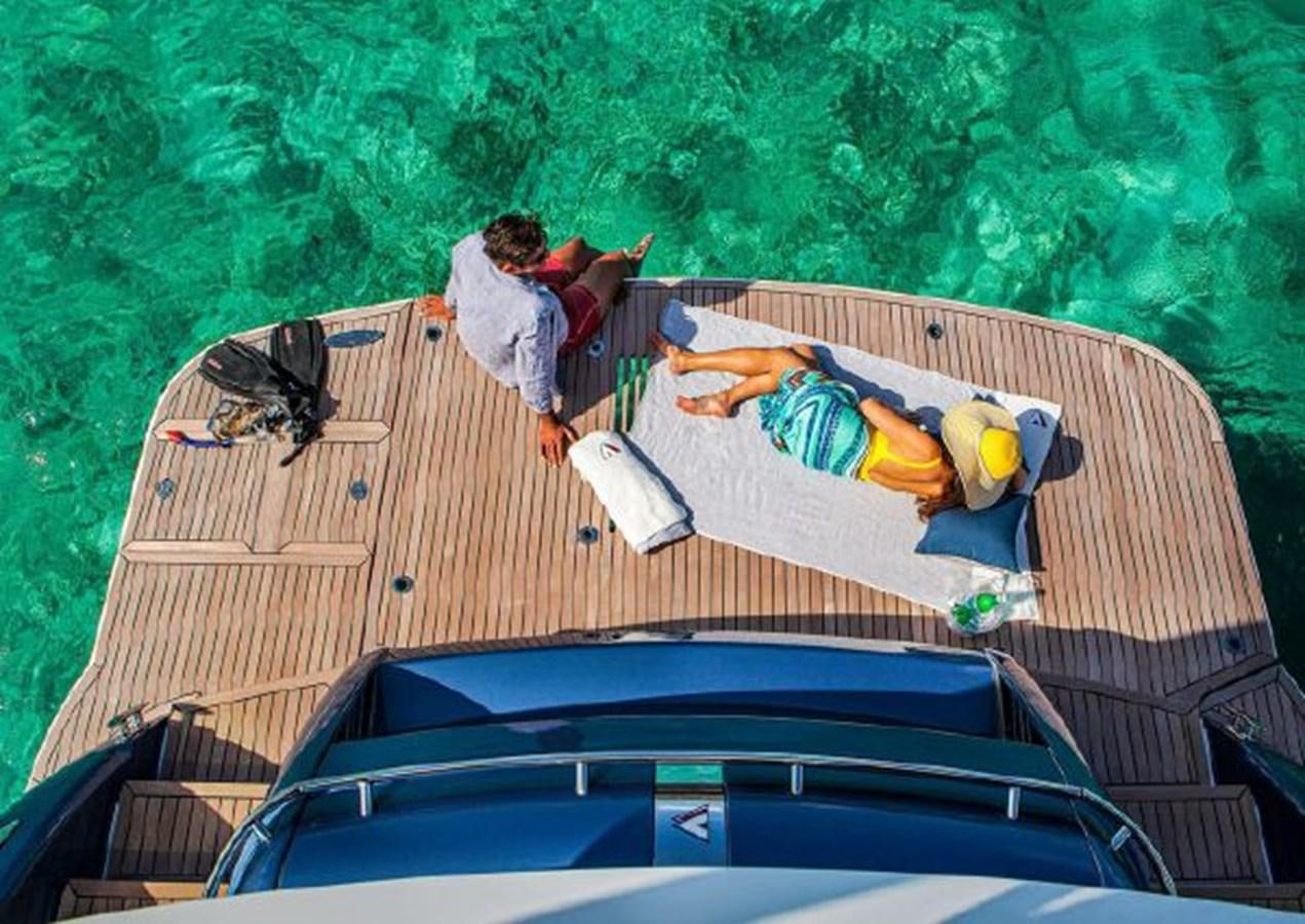 a group of people on a trampoline aboard 2023 RIVIERA 66 BELIZE DAYBRIDGE Yacht for Sale