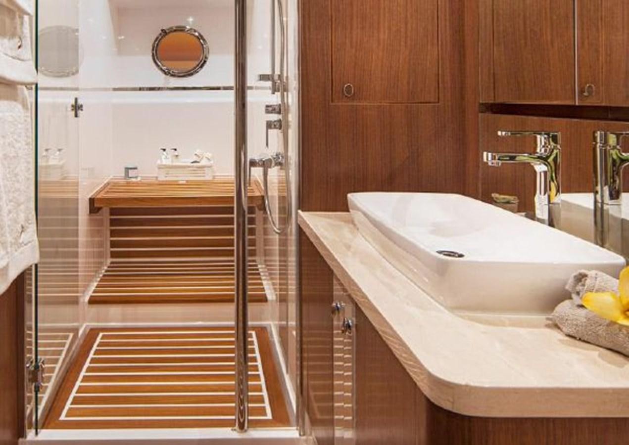 a bathroom with a sink and a shower aboard 2023 RIVIERA 66 BELIZE DAYBRIDGE Yacht for Sale