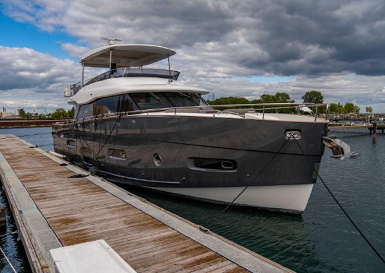 a boat docked at a pier aboard 2016 AZIMUT MAGELLANO 66 Yacht for Sale