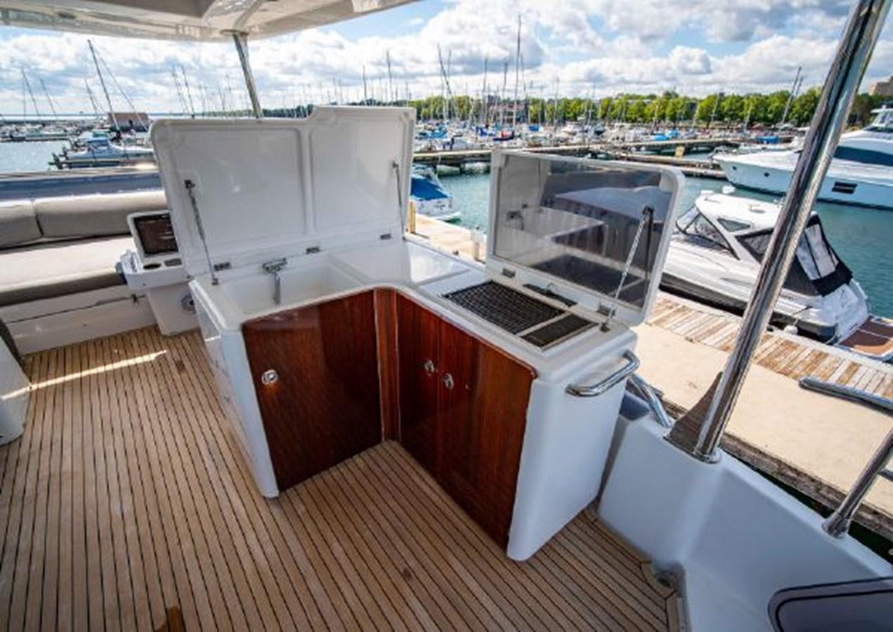 a boat on a deck aboard 2016 AZIMUT MAGELLANO 66 Yacht for Sale