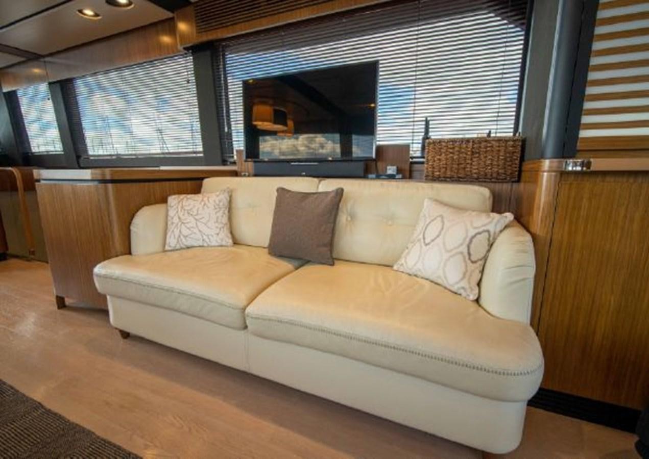 a couch in a living room aboard 2016 AZIMUT MAGELLANO 66 Yacht for Sale