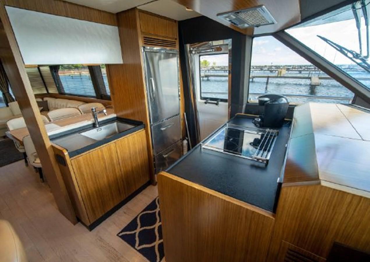 a kitchen with a sink and a large window aboard 2016 AZIMUT MAGELLANO 66 Yacht for Sale