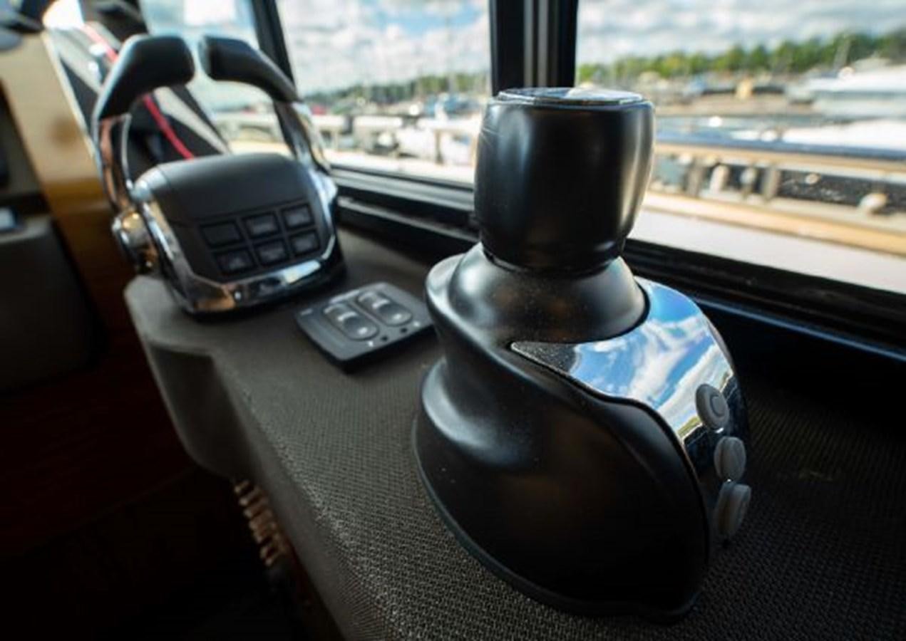 a close-up of a steering wheel aboard 2016 AZIMUT MAGELLANO 66 Yacht for Sale