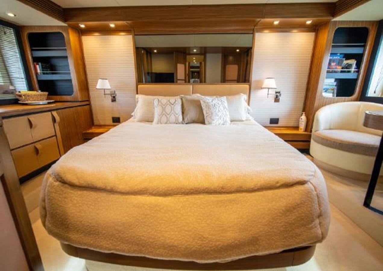 a large bed in a hotel room aboard 2016 AZIMUT MAGELLANO 66 Yacht for Sale