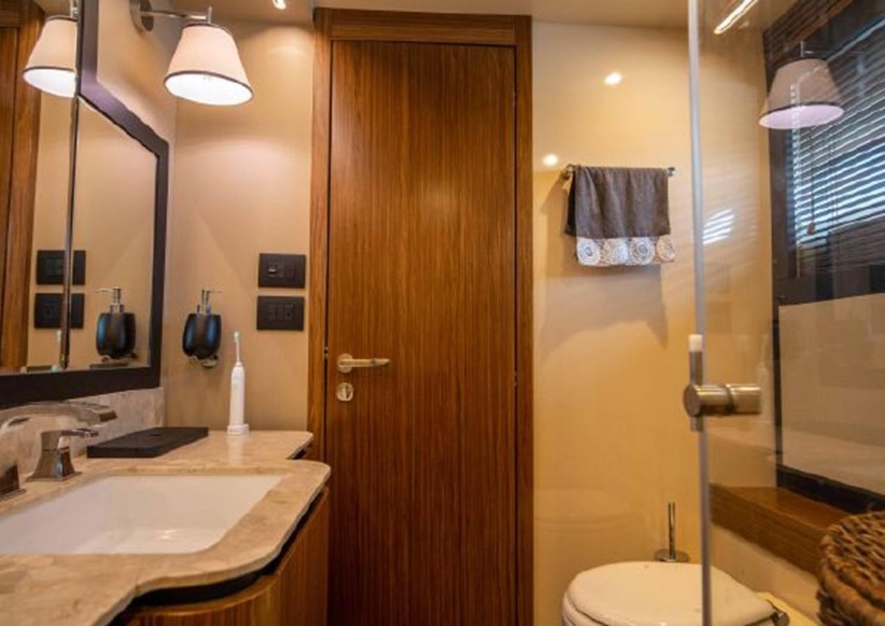 a bathroom with a sink and a shower aboard 2016 AZIMUT MAGELLANO 66 Yacht for Sale