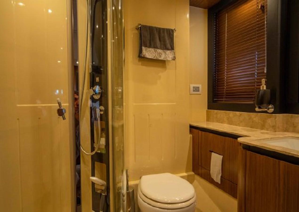 a bathroom with a glass shower door aboard 2016 AZIMUT MAGELLANO 66 Yacht for Sale