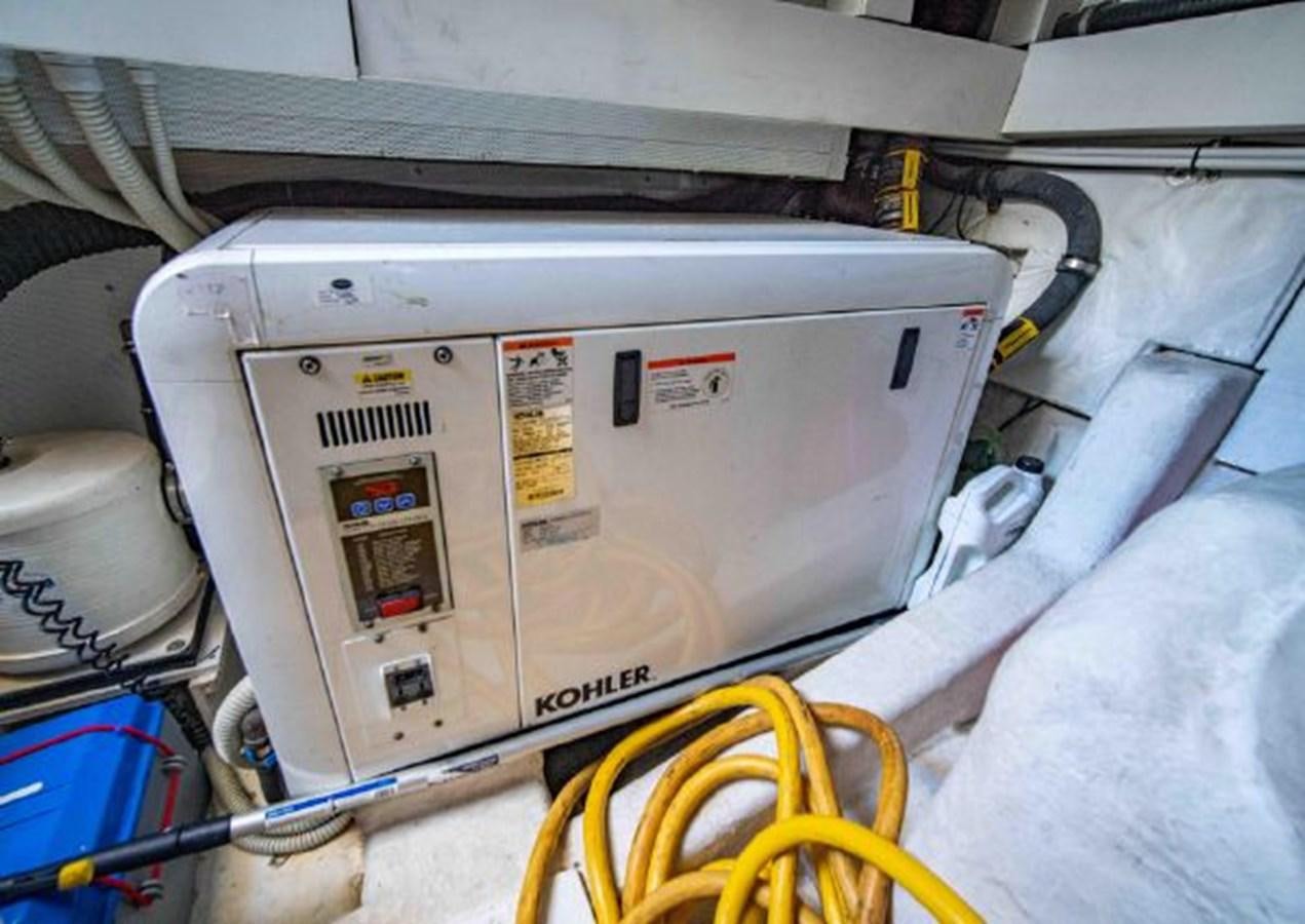 a white machine with a yellow tape aboard 2016 AZIMUT MAGELLANO 66 Yacht for Sale