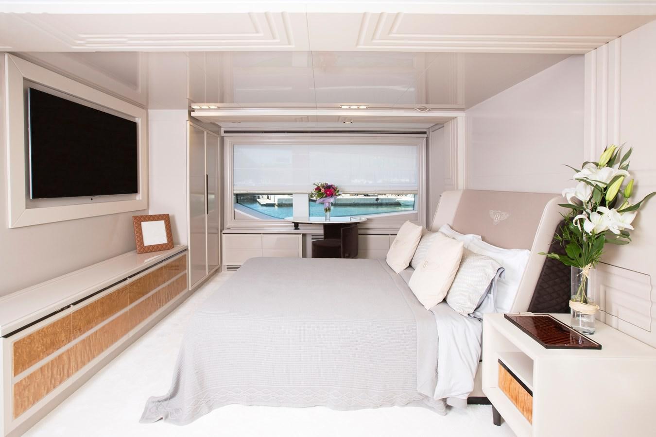 a bedroom with a large bed aboard SONNY II Yacht for Sale