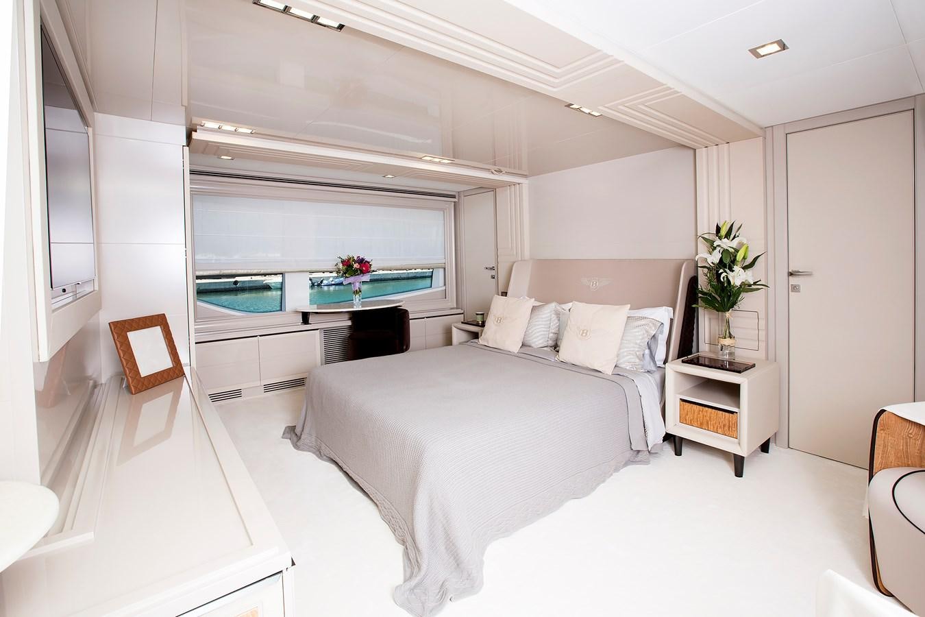 a room with a bed and a table aboard SONNY II Yacht for Sale