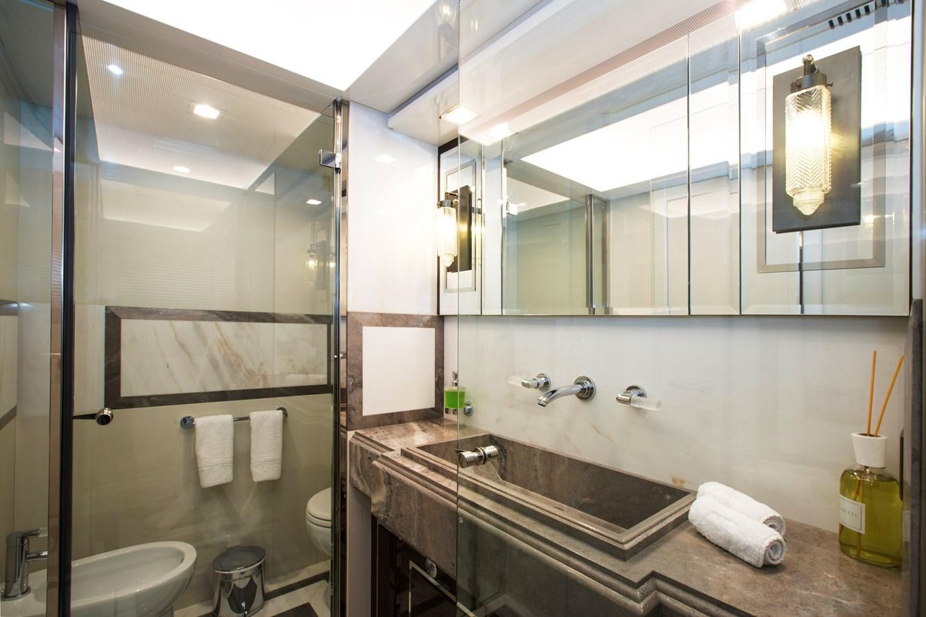 a bathroom with a large mirror aboard SONNY II Yacht for Sale