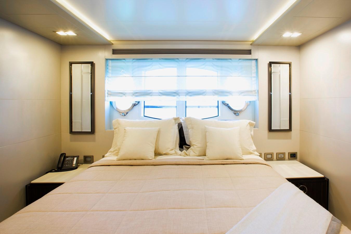 a hotel room with a large bed aboard SONNY II Yacht for Sale