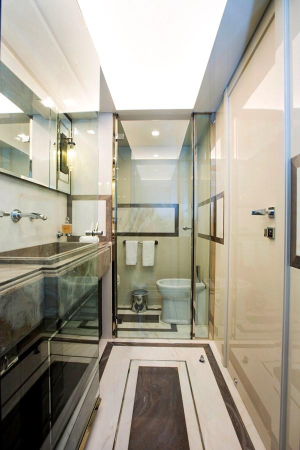 a bathroom with a glass shower aboard SONNY II Yacht for Sale