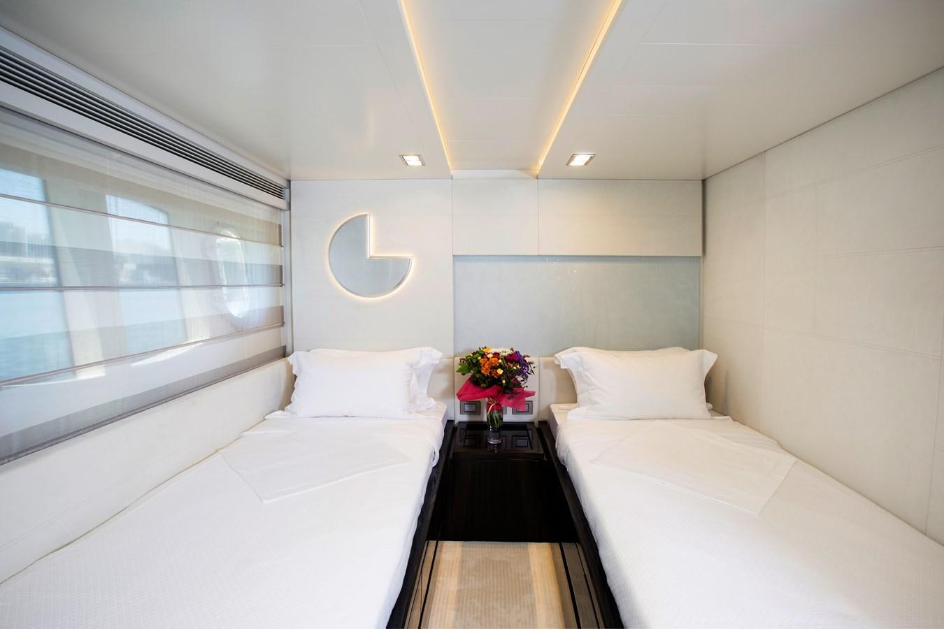 a room with a bed and a table aboard SONNY II Yacht for Sale
