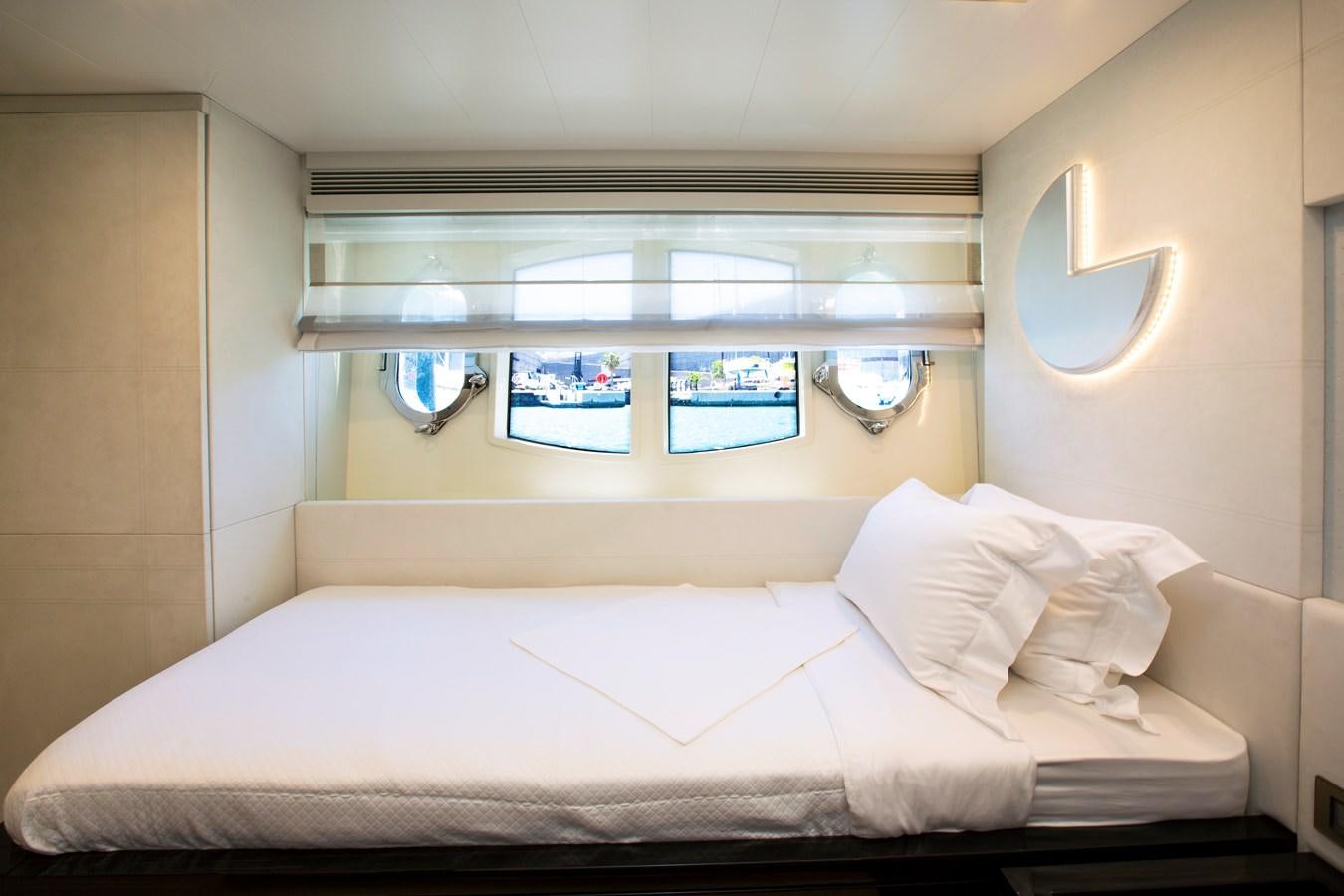 a bed with white sheets aboard SONNY II Yacht for Sale